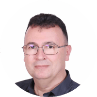Professional head-and-shoulders portrait of a middle-aged man with glasses wearing a dark shirt, facing the camera.