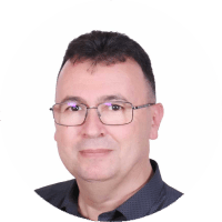 Professional head-and-shoulders portrait of a middle-aged man with glasses wearing a dark shirt, facing the camera.